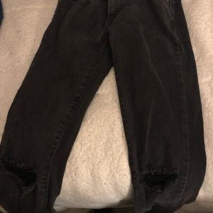 Lightly worn black faded distressed Levi’s jeans